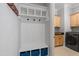 Convenient mudroom with built-in storage, coat hooks, and cubbies, leading to the laundry room at 3029 Mountain Hill Dr, Wake Forest, NC 27587