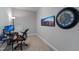 A well-lit office space with a modern desk, comfortable chair, and a large monitor for a productive work environment at 3029 Mountain Hill Dr, Wake Forest, NC 27587