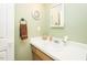 Bathroom featuring a single sink vanity with ample counter space and a decorative mirror at 304 Cornelia Dr, Graham, NC 27253