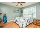 Bedroom with natural light, hardwood floors, and a twin bed at 304 Cornelia Dr, Graham, NC 27253