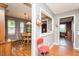Open dining area featuring wood floors, large windows, and decorative lighting at 304 Cornelia Dr, Graham, NC 27253