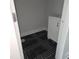 Cozy bathroom featuring modern black and white tiled floors and a classic white vanity at 305 E Harnett St, Benson, NC 27504