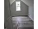 Cozy bedroom with hardwood flooring and a large window, perfect for relaxation at 305 E Harnett St, Benson, NC 27504