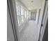 Bright hallway with tile floors and multiple windows at 305 E Harnett St, Benson, NC 27504