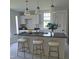 Modern kitchen with a breakfast bar, marble countertops, and pendant lighting at 305 E Harnett St, Benson, NC 27504
