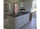 Spacious kitchen island with a double sink and white cabinets at 305 E Harnett St, Benson, NC 27504