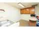 Simple basement kitchen area with a stainless steel sink and dark cabinets at 306 N Sixth St, Mebane, NC 27302
