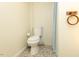 This basic, yet functional, bathroom includes a toilet and a shower at 306 N Sixth St, Mebane, NC 27302