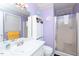 Bright bathroom featuring a vanity, mirror, and shower at 306 N Sixth St, Mebane, NC 27302