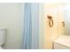 The half bathroom features bright and functional fixtures and tile flooring at 306 N Sixth St, Mebane, NC 27302