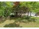 Charming single-Gathering home with a well-manicured lawn and mature trees at 306 N Sixth St, Mebane, NC 27302