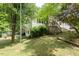 Two story single Gathering home with fenced in yard and deck at 306 N Sixth St, Mebane, NC 27302
