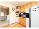 Functional kitchen with white appliances, ample storage, and convenient laundry area at 306 N Sixth St, Mebane, NC 27302