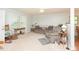 Cozy living room with a rocking chair, decorative tables, and plenty of natural light at 306 N Sixth St, Mebane, NC 27302