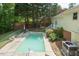 A stunning in-ground pool surrounded by a well maintained backyard at 306 N Sixth St, Mebane, NC 27302