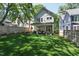 Spacious backyard features a covered patio with seating, lawn and fenced yard at 308 Furches St, Raleigh, NC 27607