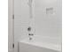 Bright bathroom with a white-tiled shower and a bathtub with chrome fixtures at 308 Furches St, Raleigh, NC 27607