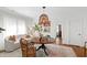 Bright dining area featuring an ornate hanging light fixture and ample seating at 308 Furches St, Raleigh, NC 27607