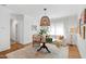 Inviting dining area with a unique light fixture, comfortable seating, and stylish decor at 308 Furches St, Raleigh, NC 27607