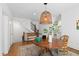Cozy dining area with unique lighting fixture, perfect for intimate gatherings and entertaining at 308 Furches St, Raleigh, NC 27607