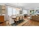 Elegant dining room with large windows, hardwood floors, and a decorative chandelier at 308 Furches St, Raleigh, NC 27607
