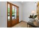 Elegant entryway with a wood door, hardwood floors, and stylish decor at 308 Furches St, Raleigh, NC 27607