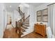 Bright entryway with staircase, wood floors, and charming decorative accents at 308 Furches St, Raleigh, NC 27607