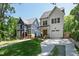 Two beautiful homes with well-maintained lawns and driveways, showcasing curb appeal and architectural style at 308 Furches St, Raleigh, NC 27607