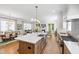Spacious kitchen featuring a large island with seating, a gas range, and an open floor plan at 308 Furches St, Raleigh, NC 27607