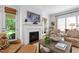 Cozy living room featuring a fireplace, comfortable seating, and stylish decor at 308 Furches St, Raleigh, NC 27607