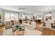 Open-concept living room featuring hardwood floors, stylish furniture, and abundant natural light at 308 Furches St, Raleigh, NC 27607
