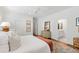Serene main bedroom with a soft color palette and ensuite bathroom view at 308 Furches St, Raleigh, NC 27607