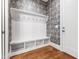 Well-organized mudroom with bench, hooks, and storage cubbies for easy organization at 308 Furches St, Raleigh, NC 27607