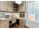 Functional office space with custom built-ins, ample storage, and a bright window at 308 Furches St, Raleigh, NC 27607