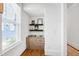 Efficient office nook with shelves and cabinetry, complemented by natural light at 308 Furches St, Raleigh, NC 27607