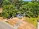 Lovely one-story house surrounded by lush trees offering a private and serene setting, showcasing the expansive greenery at 310 Chicopee Rd, Benson, NC 27504