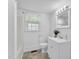 Bright bathroom with white fixtures, neutral tile flooring, and a crisp, modern design at 310 Chicopee Rd, Benson, NC 27504