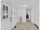 Inviting entryway boasts light tile floor and door leading outdoors at 310 Chicopee Rd, Benson, NC 27504