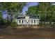 Charming single-story home with mature trees, inviting front porch, and a classic design at 310 Chicopee Rd, Benson, NC 27504