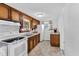 Traditional eat-in kitchen with ample counter space, bright lighting, and classic wood cabinetry at 310 Chicopee Rd, Benson, NC 27504