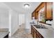 Traditional kitchen featuring wood cabinets, laminate countertops, and a stainless steel sink at 310 Chicopee Rd, Benson, NC 27504