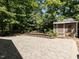 Beautiful backyard, surrounded by mature trees, and offering a private outdoor space at 312 Heidinger Dr, Cary, NC 27511