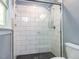 This modern bathroom features a walk-in shower with white subway tile and a glass enclosure at 312 Heidinger Dr, Cary, NC 27511