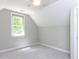 Bright bedroom with neutral walls and carpet, offering a cozy and inviting atmosphere at 312 Heidinger Dr, Cary, NC 27511