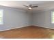 Spacious bedroom featuring a ceiling fan and windows for ample natural light at 312 Heidinger Dr, Cary, NC 27511