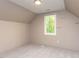 This bedroom has neutral walls and carpet with an abundance of natural light at 312 Heidinger Dr, Cary, NC 27511