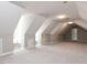 Large bonus room with white walls, neutral colored walls and carpet at 312 Heidinger Dr, Cary, NC 27511
