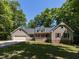 Charming home with a manicured lawn, featuring a covered front porch and attached two-car garage at 312 Heidinger Dr, Cary, NC 27511