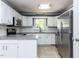 Modern kitchen with stainless steel appliances, sleek countertops, and ample cabinet space at 312 Heidinger Dr, Cary, NC 27511