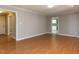 Hardwood floors flow through the open living area, leading to other rooms at 312 Heidinger Dr, Cary, NC 27511